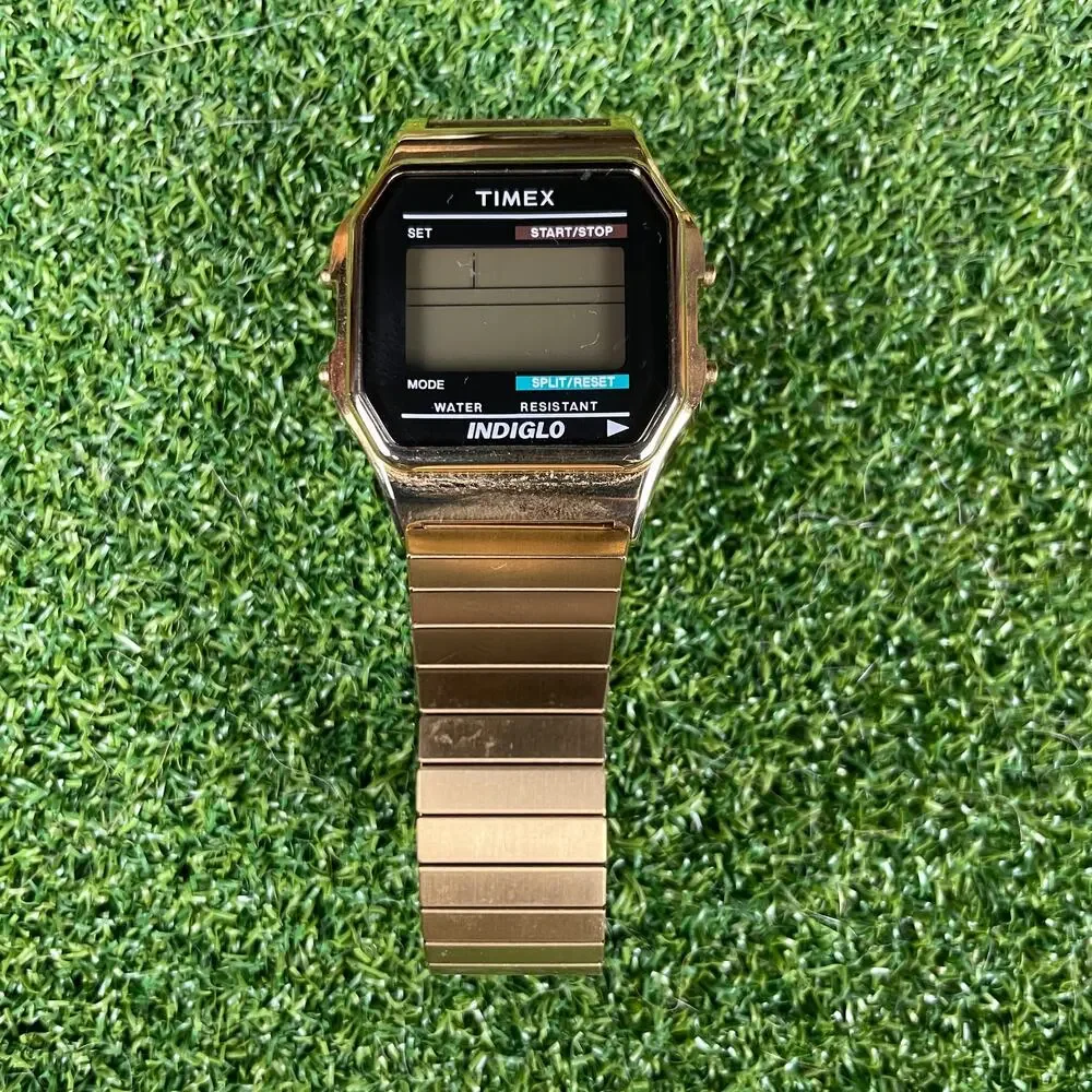 Vintage 80s Timex Mens Classic Digital Indiglo Stretch Band Gold Tone Watch